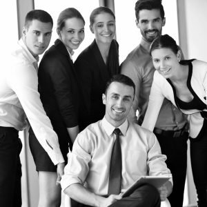 Group of happy young  business people in a meeting at office